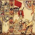 Cantigas de Santa Maria 28. Arabské obležení Konstantinopole 717-718 AD v
kulisách 13. století. Uprostřed iluminace vidíme gravitační prak s
kolovým podvozkem, stany obléhatelů, typické arabské kopí, kušiníky v
šupinových zbrojích s železnými lebkami a bourání hradby pod
improvizovanou střechou. Špičaté klobouky obránců vlevo pravděpodobně...